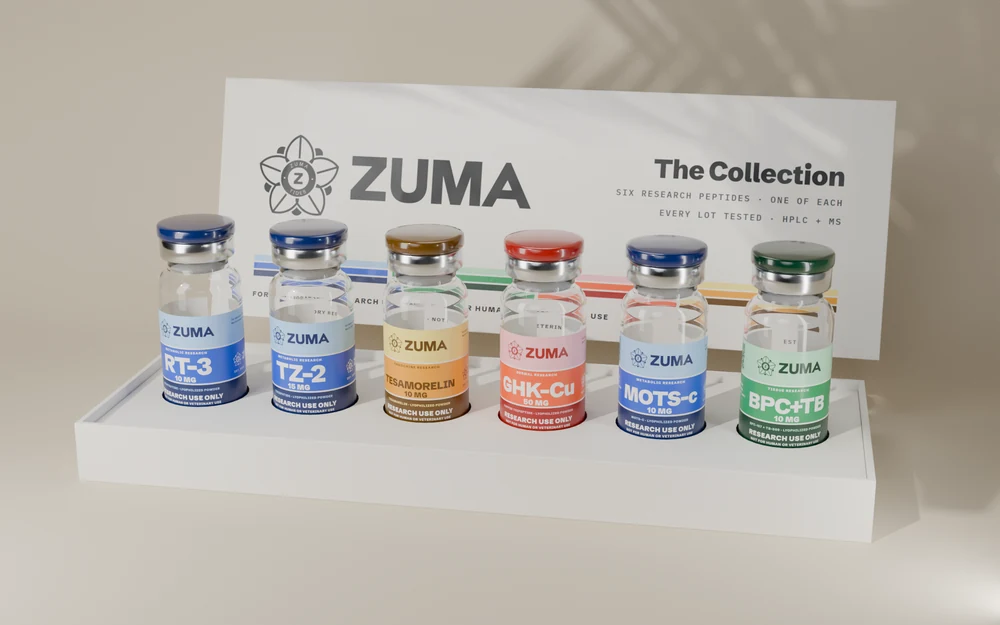 The ZUMA Collection box: six vials in a fitted tray and a lid printed with the four research areas